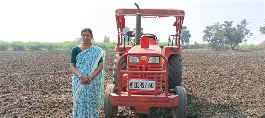 A woman farmer with a tractor supplied through a Custom Hiring Centre