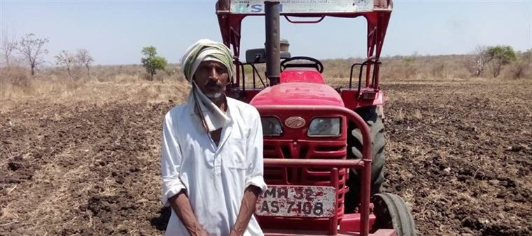 Raviraj Pradeep Shete with a tractor hired from his village Custom Hiring Centre